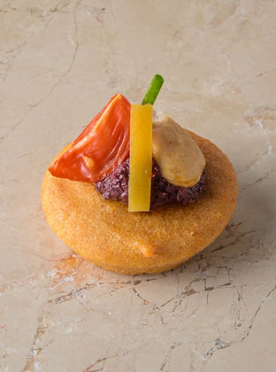 Almond cake, Marconi almond, smoked tomato, harissa olive tapenade, preserved lemon