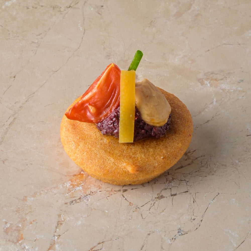 Almond cake, Marconi almond, smoked tomato, harissa olive tapenade, preserved lemon