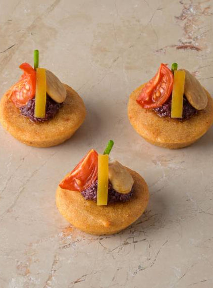 Almond cake, Marconi almond, smoked tomato, harissa olive tapenade, preserved lemon