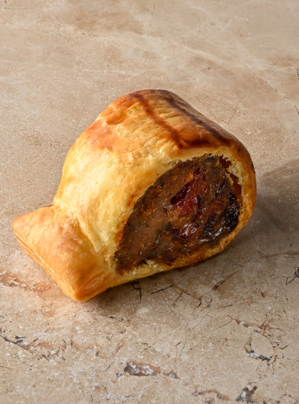 Baby poached ham hock and sage sausage rolls with poached orange peel