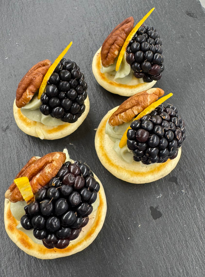 Barkham blue cheese blini, hedgerow jam, pecan, blackberry
