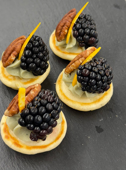 Barkham blue cheese blini, hedgerow jam, pecan, blackberry