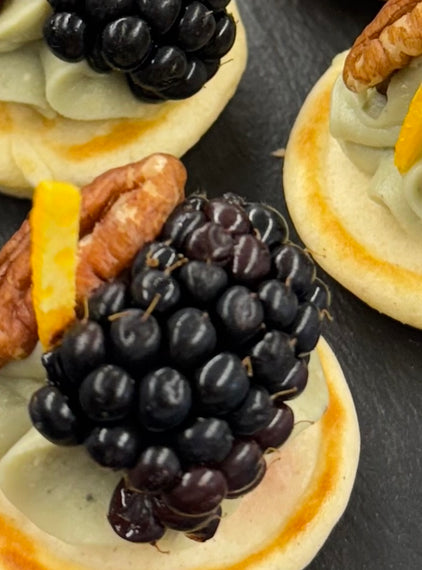 Barkham blue cheese blini, hedgerow jam, pecan, blackberry