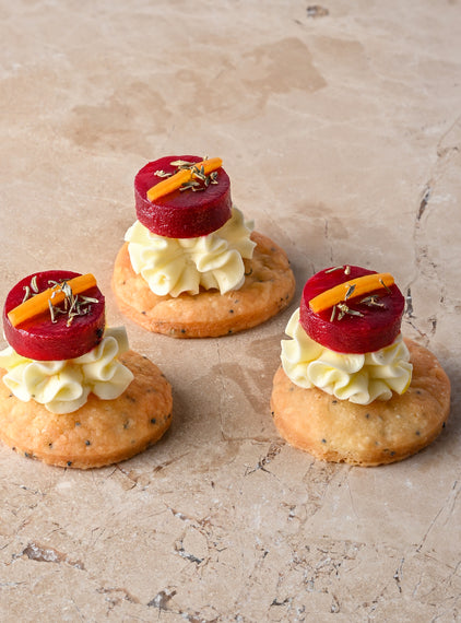 Cumin and charcoal blini, roast butternut, confit garlic butternut puree, almond