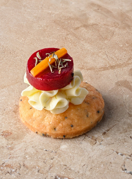 Cumin and charcoal blini, roast butternut, confit garlic butternut puree, almond