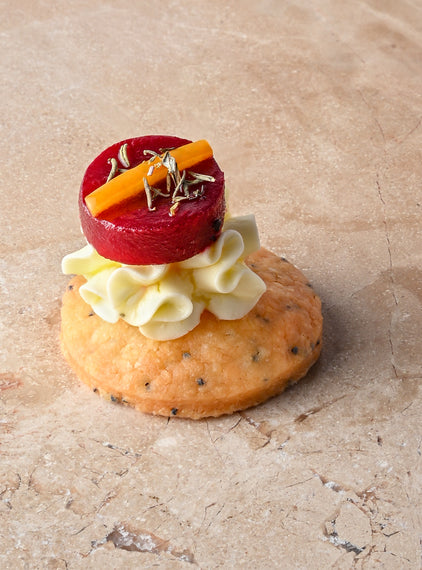 Cumin and charcoal blini, roast butternut, confit garlic butternut puree, almond