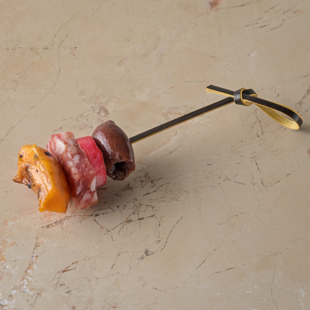 Bray cured salami, griddled apricot, black olive, pickled radish skewer