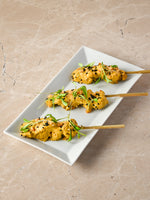 Chicken satay skewer, almond crumb, coriander cress, chopped chilli, nigella seed (GF)