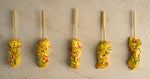 Chicken satay skewer, almond crumb, coriander cress, chopped chilli, nigella seed (GF)