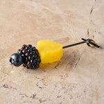 Compressed pineapple, blackberry, blueberry skewer