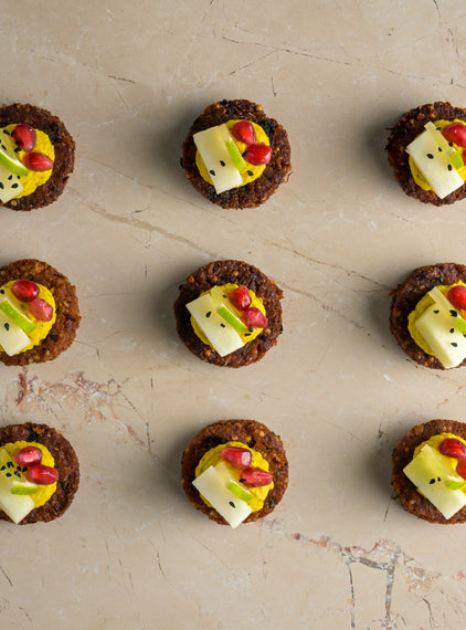 Coriander seed falafel, hummus, pickled kohlrabi, pomegranate, lime