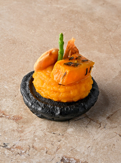 Cumin and charcoal blini, roast butternut, confit garlic butternut puree, almond