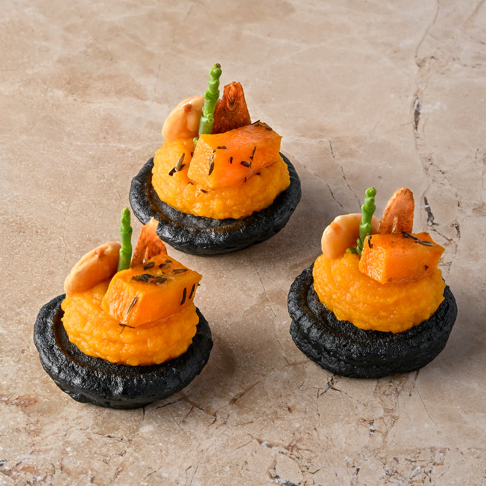 Cumin and charcoal blini, roast butternut, confit garlic butternut puree, almond