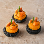 Cumin and charcoal blini, roast butternut, confit garlic butternut puree, almond