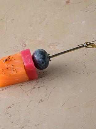 Gin cured salmon loin, juniper gin glaze, candy beetroot, gin poached peel