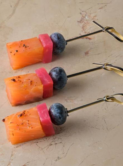 Gin cured salmon loin, juniper gin glaze, candy beetroot, gin poached peel