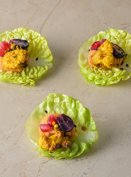 Harissa red pepper hummus, ras-el-hanout roast cauliflower, pomegranate, blushed grape, baby gem (GF)