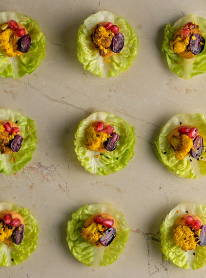 Harissa red pepper hummus, ras-el-hanout roast cauliflower, pomegranate, blushed grape, baby gem (GF)