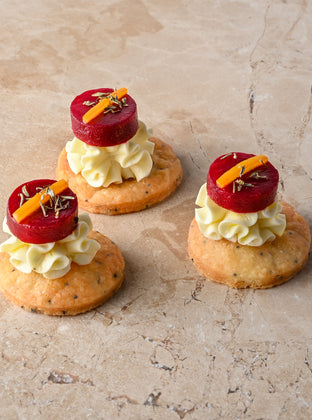 Cumin and charcoal blini, roast butternut, confit garlic butternut puree, almond