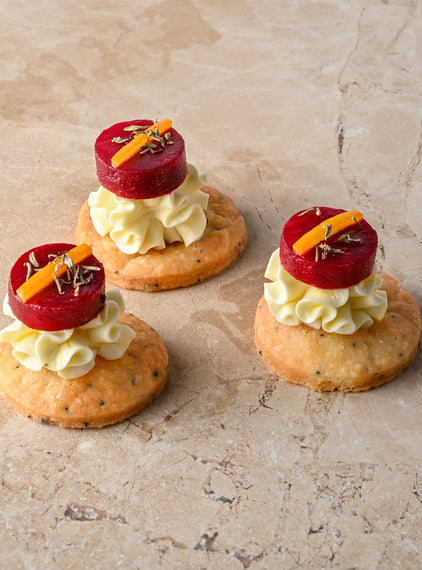 Cumin and charcoal blini, roast butternut, confit garlic butternut puree, almond