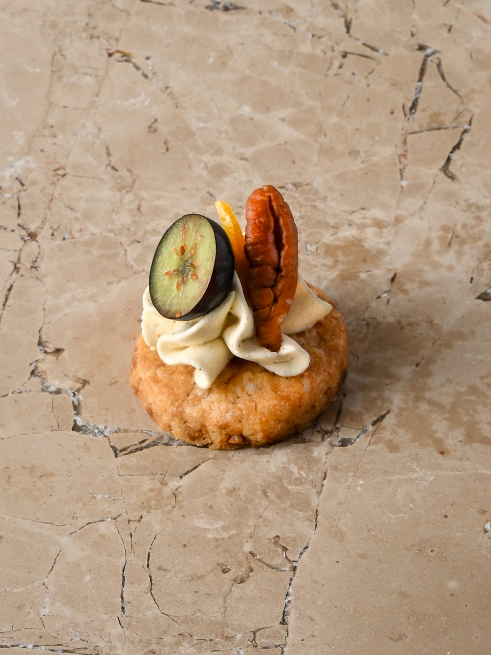 White chocolate cookie, vanilla cheesecake, toasted hazelnut and mallow, lime zest