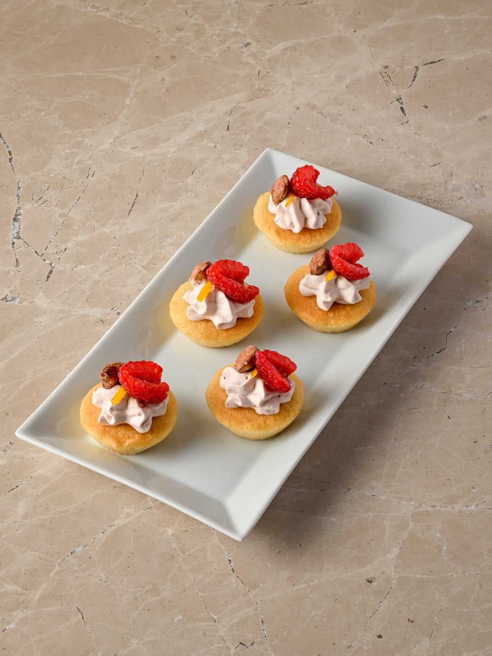 Bakewell tart, raspberry cream, fresh raspberry, sugared almond