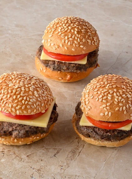 Mini cheeseburger, cheese, tomato, pickle