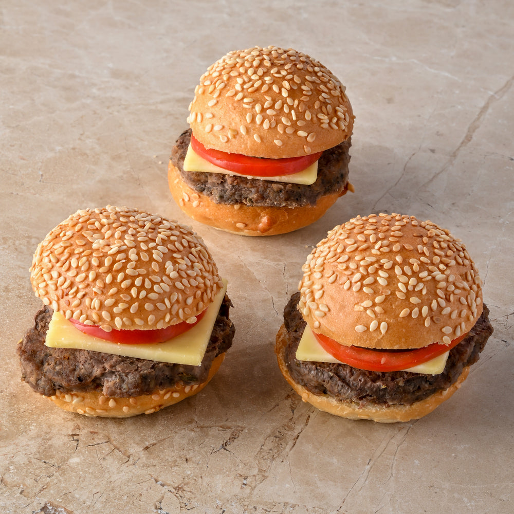Mini cheeseburger, cheese, tomato, pickle