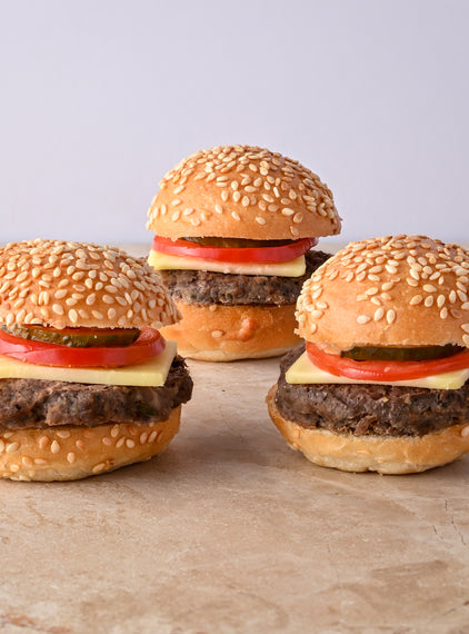 Mini cheeseburger, cheese, tomato, pickle