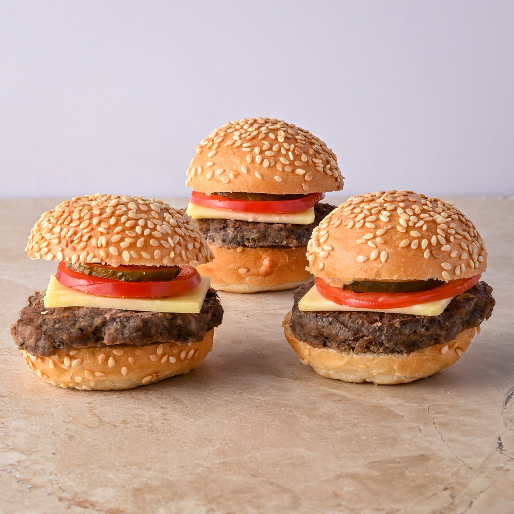 Mini cheeseburger, cheese, tomato, pickle