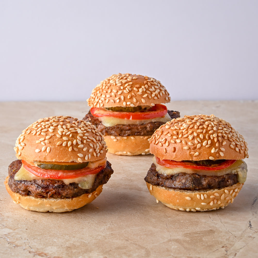 Mini cheeseburger, cheese, tomato, pickle
