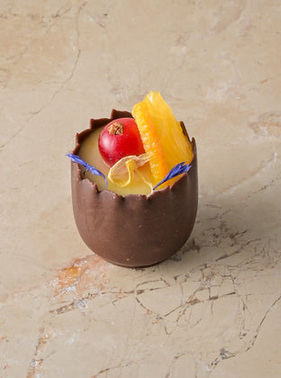 Orange cardamom posset, chocolate cup, red current, fresh orange, zest (GF)