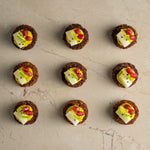 Quinoa and coriander seed falafel, tahini lime hummus, pomegranate, pickled kohlrabi