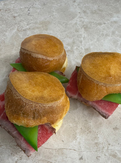 Rare roast beef Yorkshire puddings, mange tout, horseradish crème fraiche