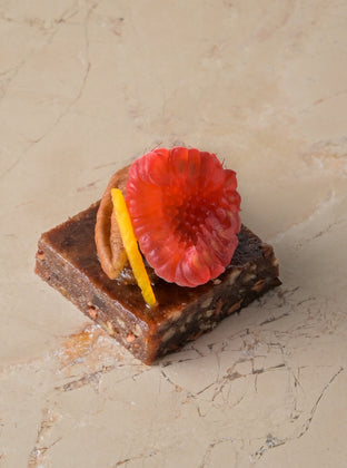 Raw cacao, medjool date and pecan truffle, date fudge, raspberry (GF)