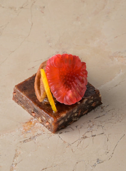 Raw cacao, medjool date and pecan truffle, date fudge, raspberry (GF)