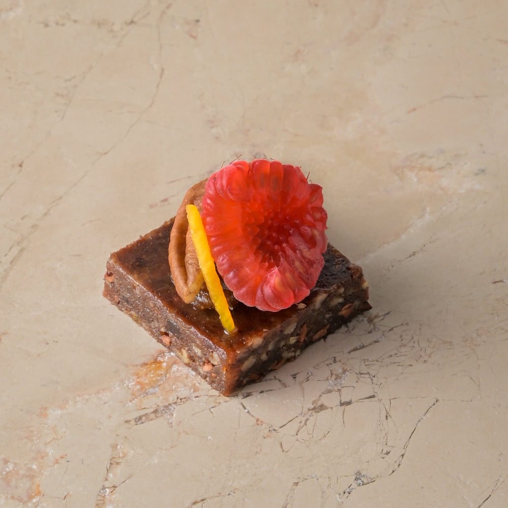 Raw cacao, medjool date and pecan truffle, date fudge, raspberry (GF)