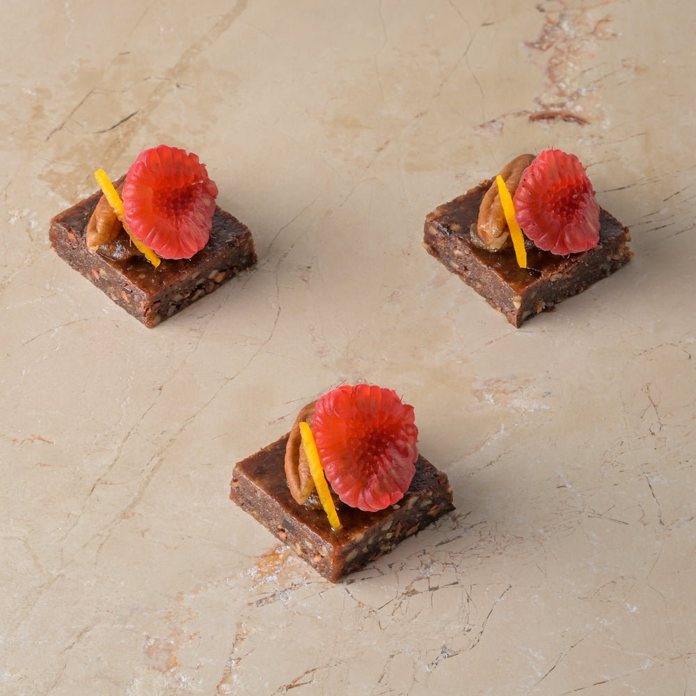 Raw cacao, medjool date and pecan truffle, date fudge, raspberry (GF)