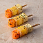Large roast root vegetable skewer, sauté white onion, thyme, pink pepper, sea salt