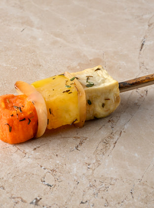 Large roast root vegetable skewer, sauté white onion, thyme, pink pepper, sea salt
