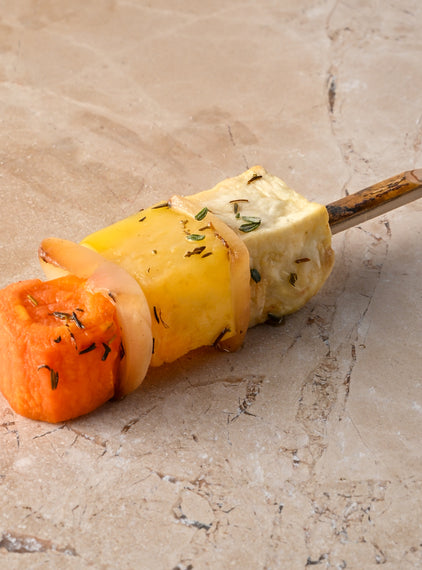 Large roast root vegetable skewer, sauté white onion, thyme, pink pepper, sea salt