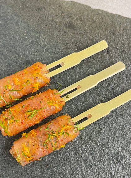 Rolled smoked salmon, dill, orange, juniper, pink pepper, clove.