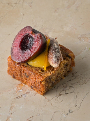 Rum and almond cake, orange curd, cherry, sugared almond