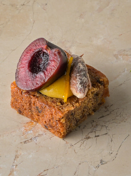 Rum and almond cake, orange curd, cherry, sugared almond