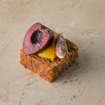 Rum and almond cake, orange curd, cherry, sugared almond