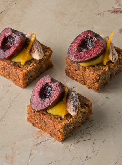 Rum and almond cake, orange curd, cherry, sugared almond