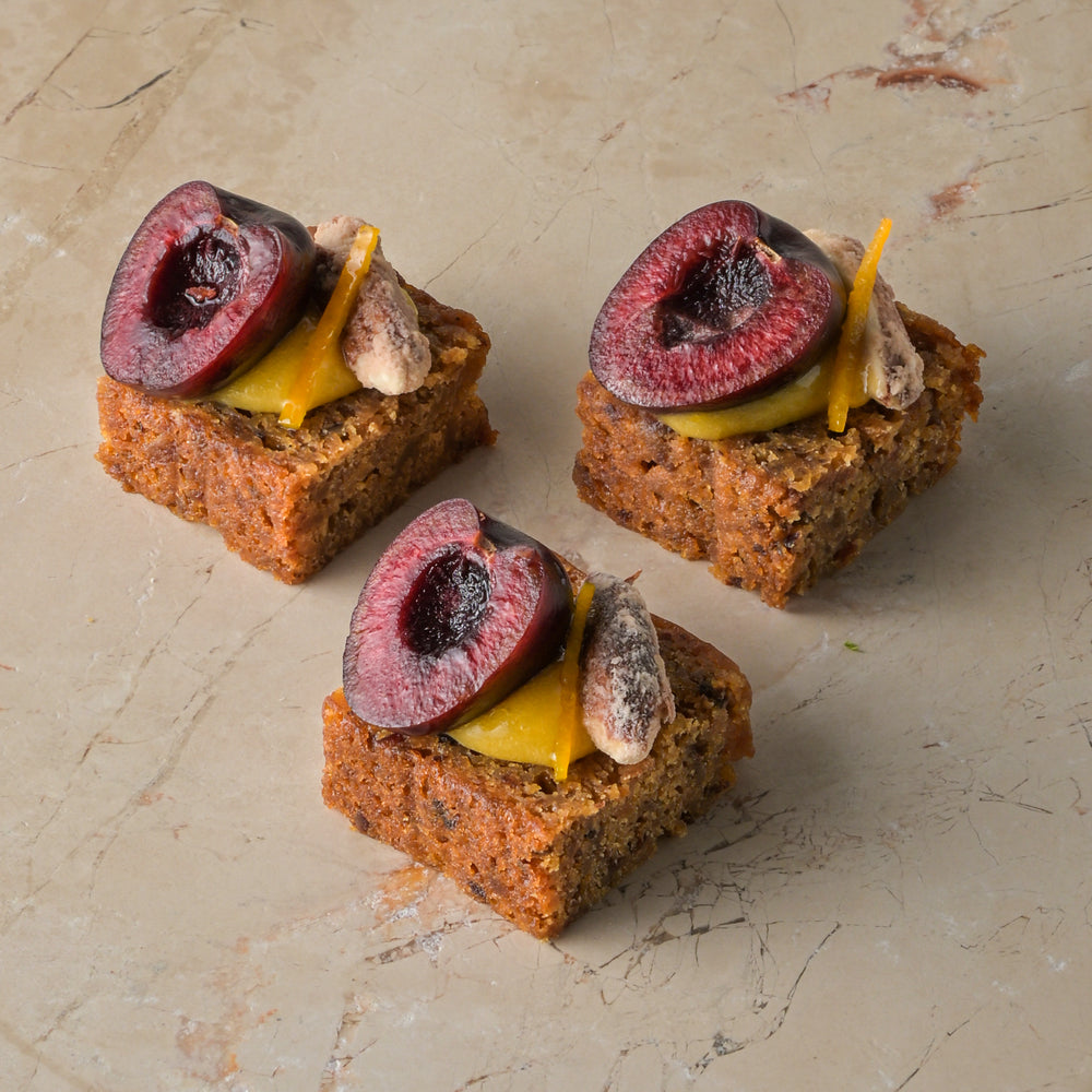 Rum and almond cake, orange curd, cherry, sugared almond