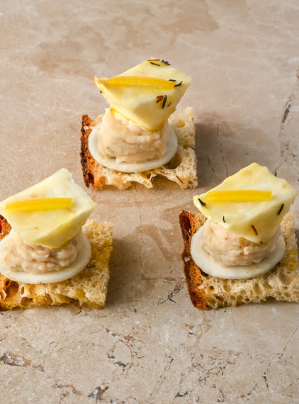 Salted thyme oil toast, cannellini bean and pink pepper puree, roast celeriac, preserved lemon