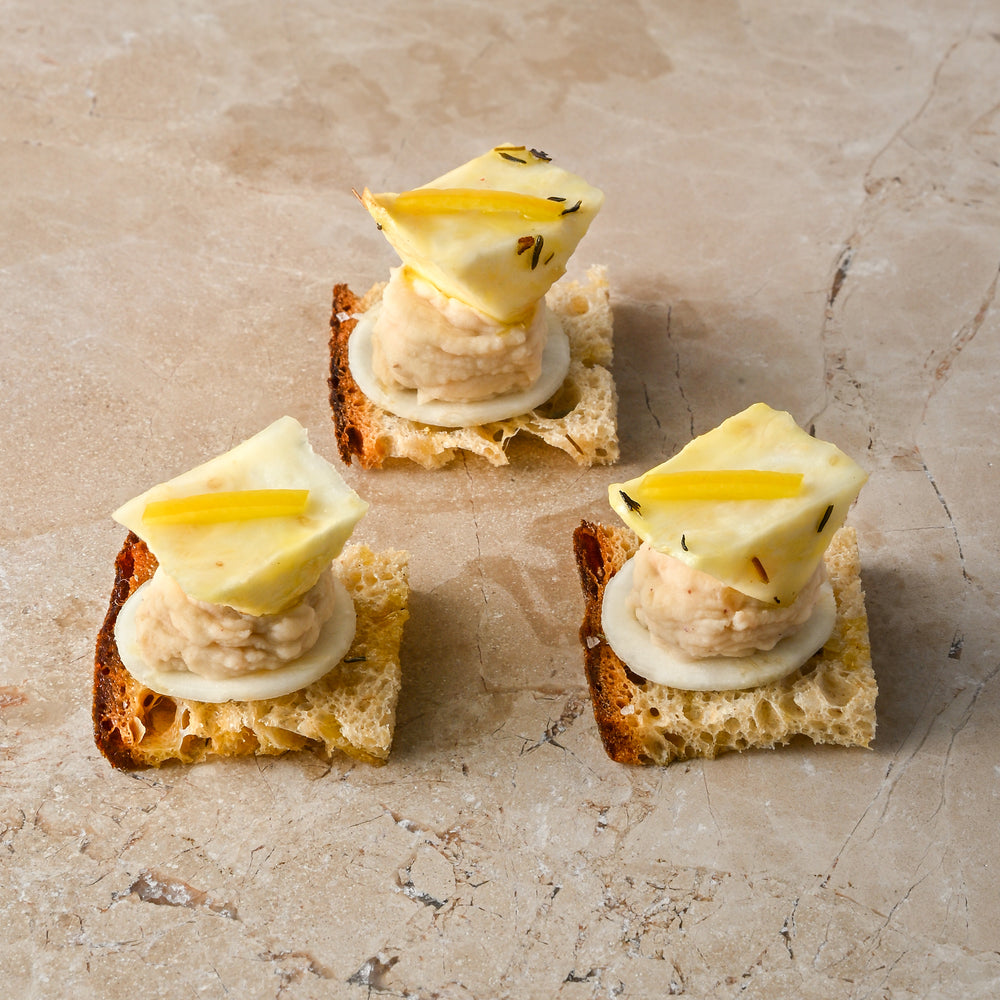 Caraway seed sourdough, cannellini bean and pink pepper puree, roast celeriac, preserved lemon