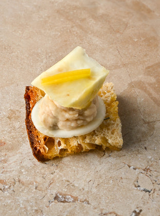Salted thyme oil toast, cannellini bean and pink pepper puree, roast celeriac, preserved lemon